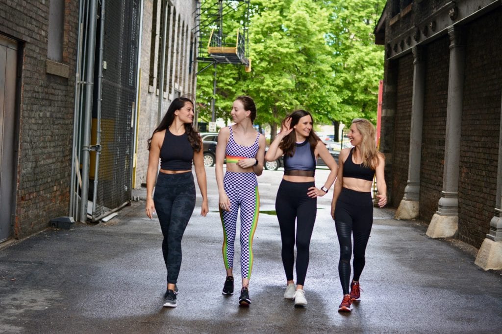 five tips for making new friends showing four women in workout clothes walking together