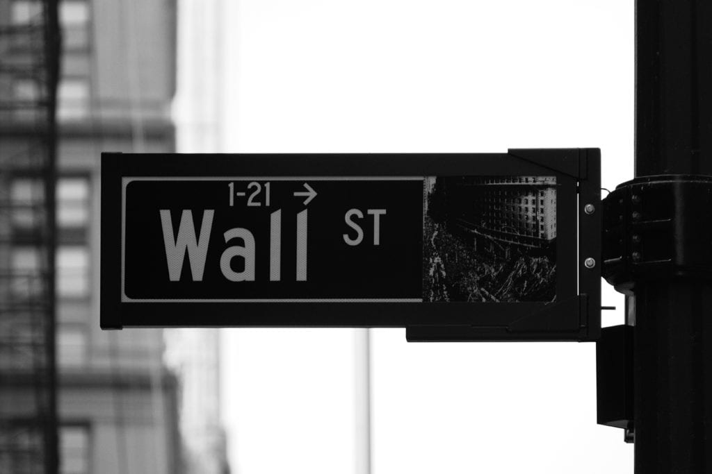 wall street sign how to leave your corporate job to become a trainer