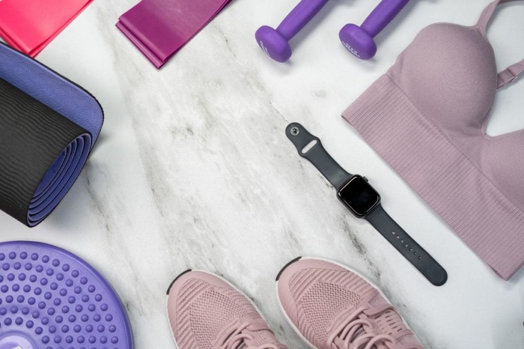 Health and fitness concept flatlay with exercise equipment on