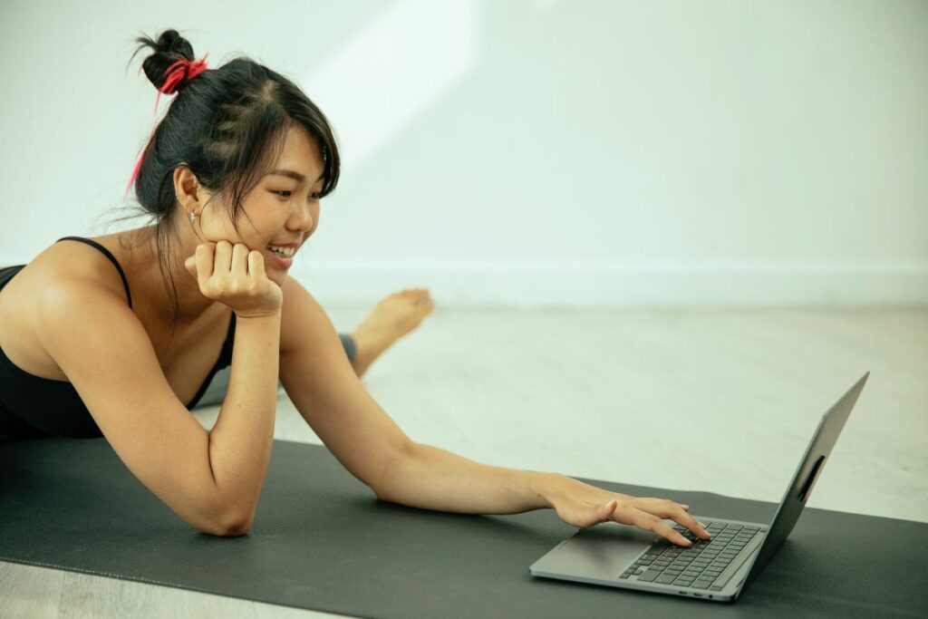 person smiling while doing online workout