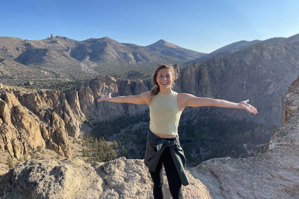 person on a mountain smiling