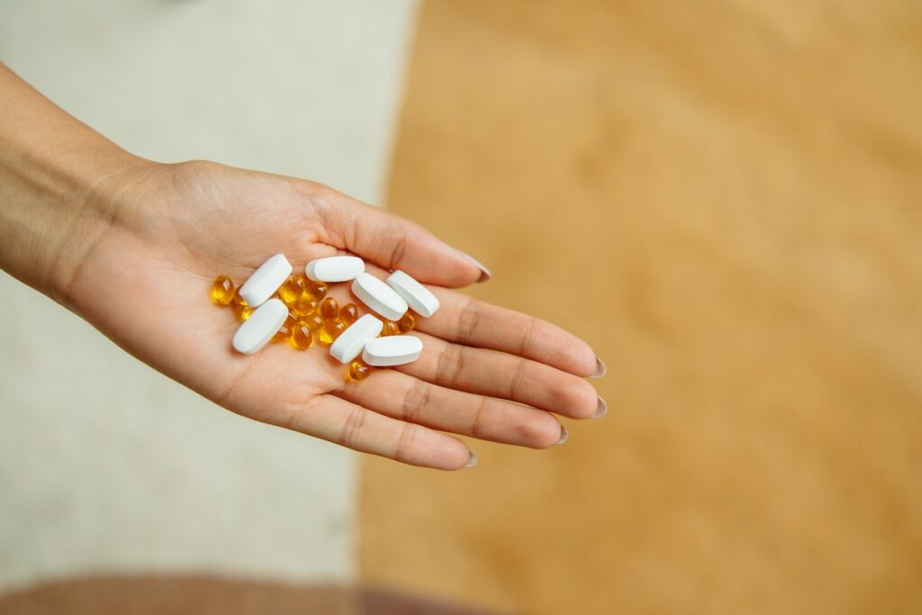 person holding supplements for biohacking