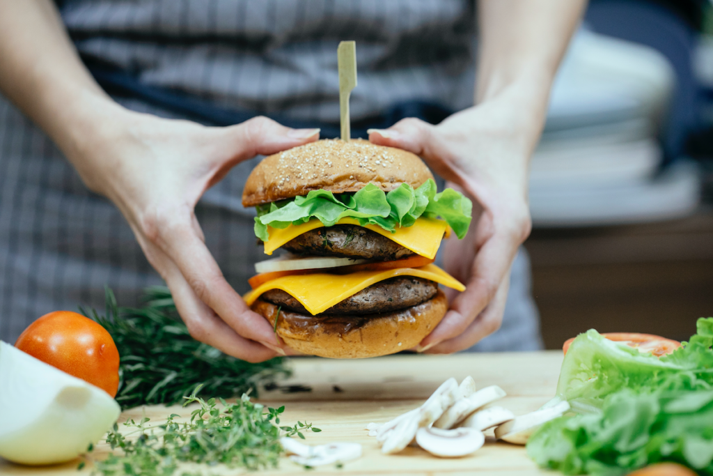 person holding hamburger