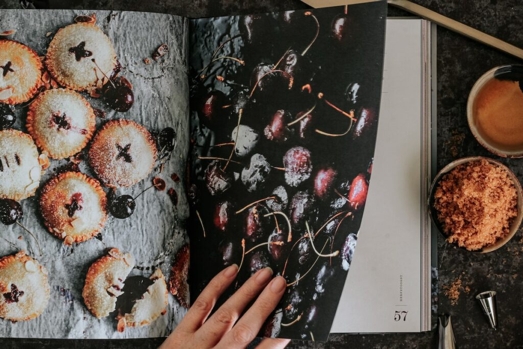 person looking at a cookbook