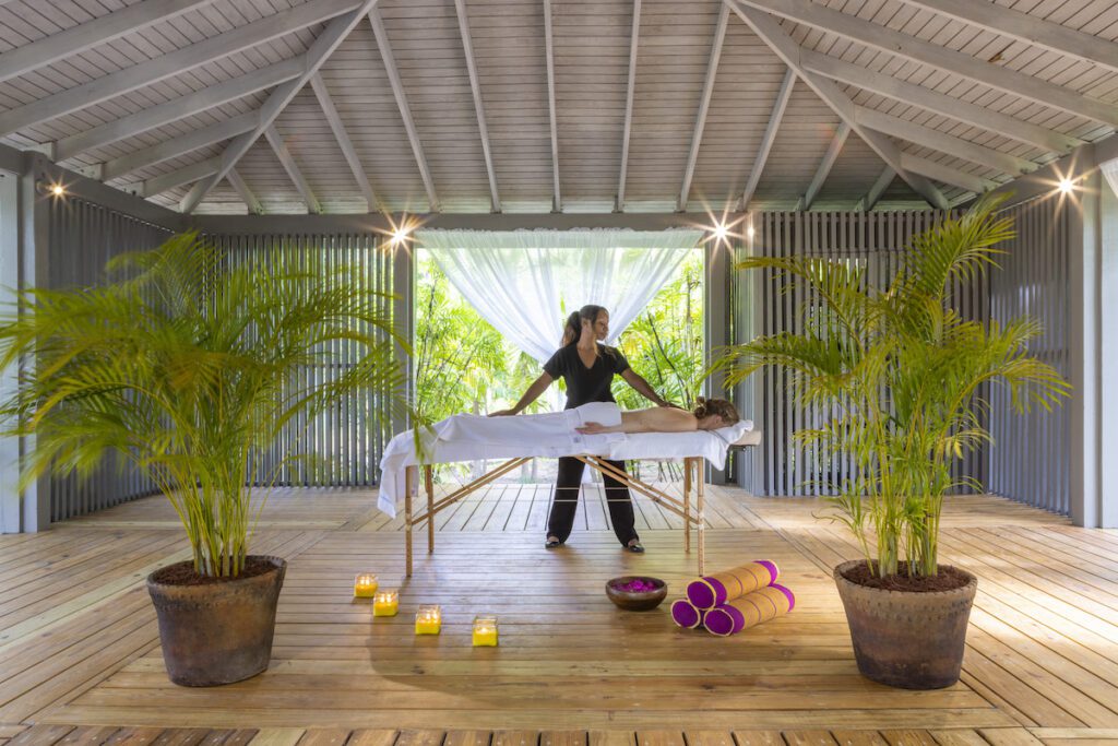 person getting a massage at a wellness retreat