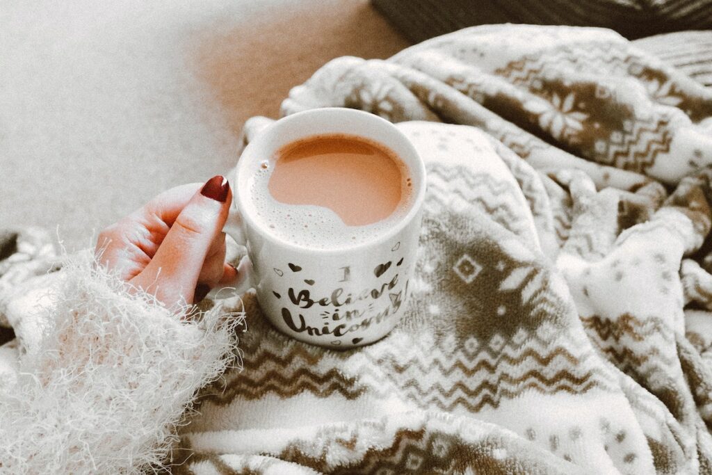 person holding hot cocoa