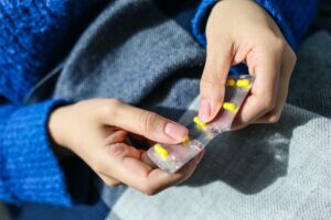 person opening medication