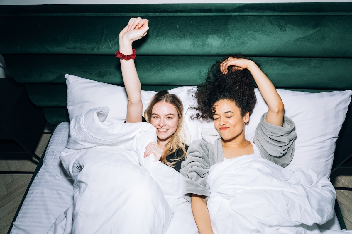 two people lounging in bed