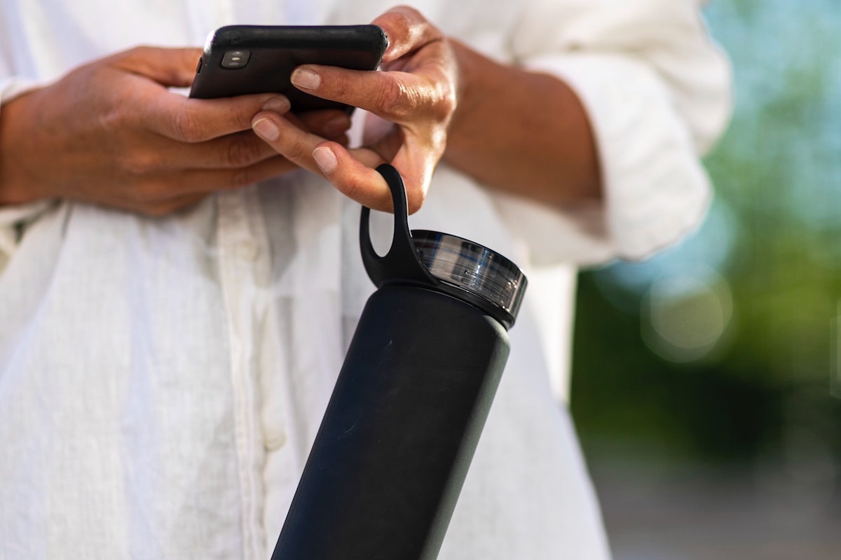 person holding water bottle