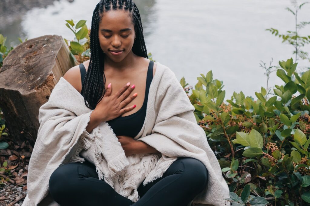 person meditating outside