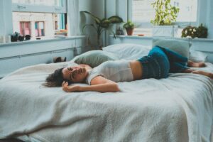 woman lying on bed