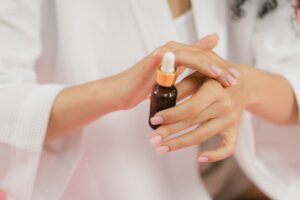 person applying bakuchiol serum